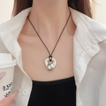 Minimalist silver irregular lava pendant necklace with black cord on model - Silver Irregular Round with Black Cord
