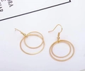 Detailed view of minimalist gold double hoop earrings with a sleek metallic finish - Gold