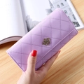 Close-up of light purple quilted long wallet with golden crown heart buckle detail - Purple
