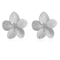 Pair of silver floral stud earrings with radiant texture on white background - Stud Earrings / Silver Stud Earrings