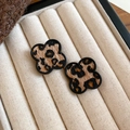 Detail view of vintage leopard print clover earrings with silver pins on a beige display - Black Brown Clover Style (14#)