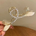 Detailed close-up of golden mermaid tail hair claw clip with rhinestones and pearls - Double Fishtail Rhinestone Claw Clip