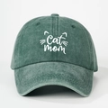 Detail of white Cat Mom embroidery and kitten whiskers on vintage washed green cotton cap - Dark Green