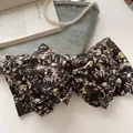Barrette à cheveux avec nœud en mousseline florale noire aux motifs colorés - Floral Murmure de Tubéreuse