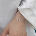 Elegant S925 silver bow hollow chain bracelet for women on a model's wrist - 925 Silver / Silver