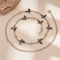 Detail of silver layered waist chain featuring black glitter butterfly and crystal charms - 113CM / Silver Black Butterfly