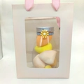 Pink gift bag with multiple yellow and orange makeup sponges in a clear plastic bottle - Yellow Series 6 Pcs With Handbag