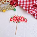 Macro shot of Merry Christmas cake topper with red and white festive lettering - Style A Merry Christmas