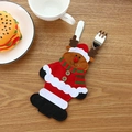Christmas reindeer felt cutlery holder with red scarf detail on a rustic wooden table - Elk Style
