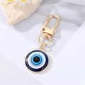 Blue Evil Eye keychain with golden spring clasp and sparkly resin charm on marble - 18mm / Gold