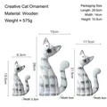 Three-piece set of wooden cat figurines in white with black spots for home decor - Three-Piece Set