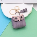 Detail of purple PU leather owl keychain with gold ring and matching tassel fringe - Taro Purple