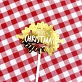 Close-up of golden mirror acrylic Merry Christmas cake topper on red checkered cloth - Light Ray White Gold Double Layer Merry Christmas