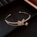 Macro detail of gold-plated double-layer cuff with butterfly and clover zircon accents - Gold Double Layer Rhinestone Butterfly Open Bangle (6#)
