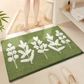 Absorbent non-slip bathroom mat with green base and white leaf pattern in plush texture - Leafy B