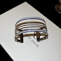 Detail of silver multi-layer cuff bracelet with glitter finish on white display box - Multi-layer Open Stackable Set / Silver Glitter