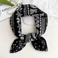 Elegant black and white paisley cotton linen square scarf tied in a stylish knot - Black Paisley