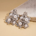 Detailed view of silver flower earrings with hammered texture and central white pearl - Flower Design (Silver Real Gold Plated) / Silver