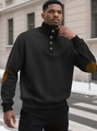 Detail van zwart gewatteerd sweatshirt met opstaande kraag en bruine elleboogstukken - Zwart