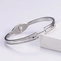 Bracciale rigido argento con numeri romani e diamanti su base geometrica - Color Acciaio