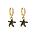 Close-up of gold starfish drop earrings with black enamel and micro-set zircon accents - Black Starfish