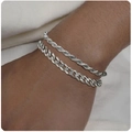 Detail of silver titanium steel twist and Cuban chain bracelets on a model's wrist - Style 6