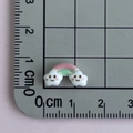 Close-up of mini rainbow cloud resin accessory with dimensions on a ruler grid - Rainbow Cloud Bridge