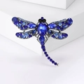Elegant dragonfly brooch with blue crystals on white background for creative fashion style - Blue