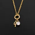 Gold titanium steel necklace featuring gothic letter q and sparkling crystal pendant - Letter Q