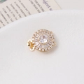 Detailed view of 14K gold plated flower clasp with shimmering cubic zirconia and pearls - Round / Double Row / White