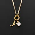 Elegant 14K gold plated stainless steel necklace featuring a crystal 'Y' letter pendant - Letter Y (XNL0103)