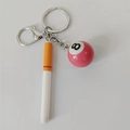 Detail of pink number 8 billiard ball and realistic cigarette pendant keychain accessory - Long Cigarette with Pink Pool Ball