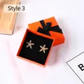 Golden starfish stud earrings with white zircons in a premium orange ribbon gift box - 8x8x4.5cm / Orange