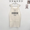 Detail of beige cotton linen apron featuring executive chef print and front pocket - Off White - EXECUTIVE Chef Print