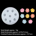 8-cavity camellia silicone mold with colorful 2cm resin flower samples on black background - 1#B884 / Clear