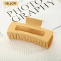 Matte yellow square hair claw clip for thick hair displayed on a modern white tray - Yellow