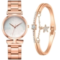 Detail of rose gold quartz watch with palm leaf dial and matching star charm bracelet - Blue + Bracelet