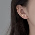 Minimalist gold butterfly stud earrings for women shown worn on lobe and cartilage - Small Butterfly / Gold