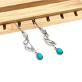 Detail of vintage silver feather earrings with oval blue stone in bohemian style - Twisted Leaf Style (BX003)