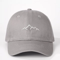 Close-up of white mountain peak embroidery on a dark grey cotton twill baseball cap - One Size / Gray