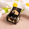 Close-up of wooden music box with Nightmare Before Christmas engraving and metal movement - Halloween O