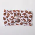 Baby nylon headband featuring a white bow with brown football patterns for toddlers - White Brown Football
