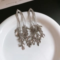 Silver color long tassel earrings with leaf pendants on white display plate - Multi-row Silver Leaf Tassel (67#)