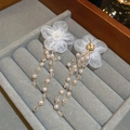 Detailed close-up of white lace flower earrings with pearl and crystal long tassels - Silver Needle-White Flower Pearl Tassel Earrings
