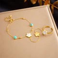 Detail of gold flower slave bracelet with blue turquoise and white petals on metallic background - White Mother-of-Pearl Flower (B1218)