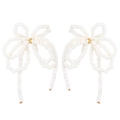Detail of beaded bow earrings with white resin pearls and gold metal accents - White Seed Bead Woven Bow Dangle Earrings (X169) / White