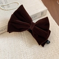 Detail of dark brown flocked bow hair clip on a vintage beige textured background - Coffee - Bow (Twist Clip)