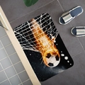 Absorbent flannel soccer door mat featuring a dynamic orange fire ball on black surface - Cool Flame Soccer (5)