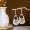 Detailed close-up of bohemian silver earrings with hollow teardrop design and leaf tassels - Silver Hollow Leaf Tassel Style 2(E2875-10)
