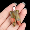 Natural agate tooth pendant with red and green spots and a silver metal clasp - Unakite